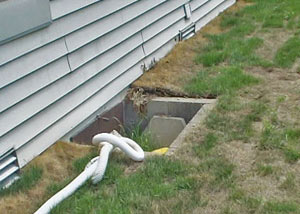 old concrete window well of a Middleburg crawl space