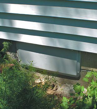 A gray crawl space vent cover in Macclenny