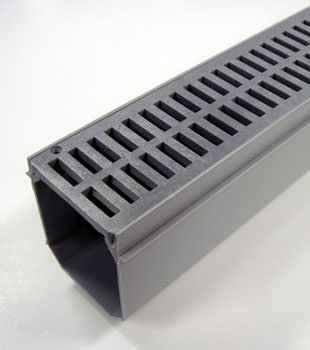 A closeup of our grated basement drainage pipe system, installed in Sanderson