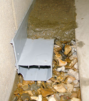 A basement drain system installed in a Jacksonville Beach home